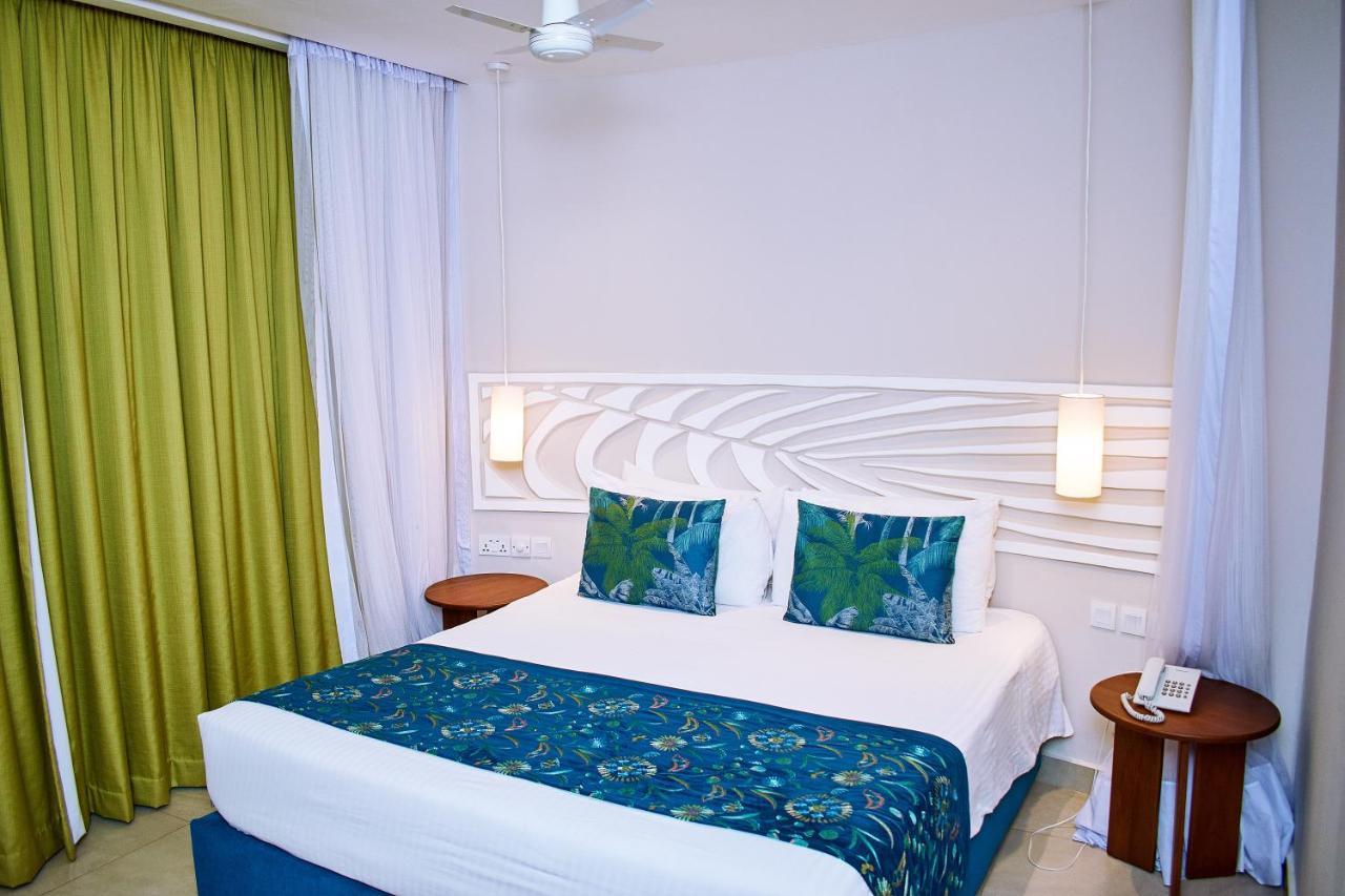 Neptune Village Beach Resort & Spa Galu Bagian luar foto